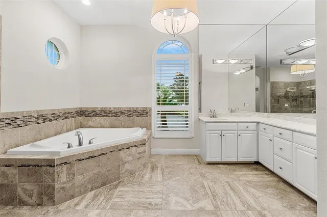 an empty room with a ceiling fan and closet area