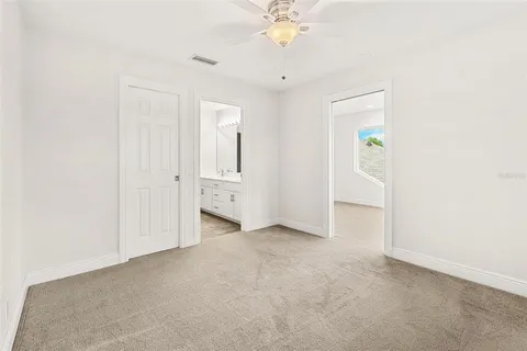 an aerial view of residential houses with outdoor space and street view