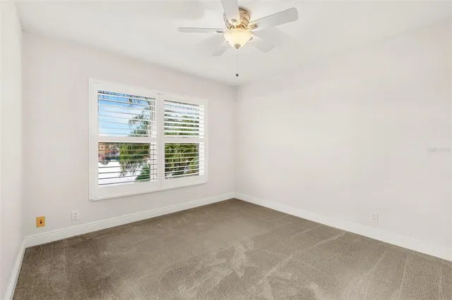 an aerial view of residential houses with outdoor space and street view