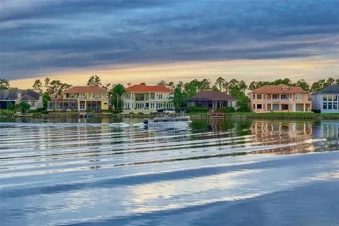 an aerial view of a house having swimming pool