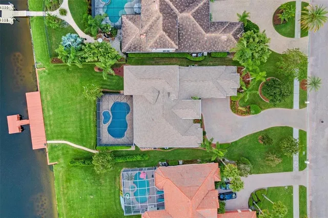 an aerial view of a house having swimming pool