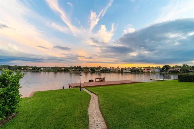 a view of a swimming pool with a yard