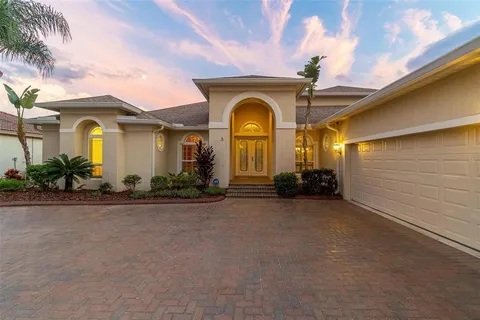 a view of a swimming pool with a yard