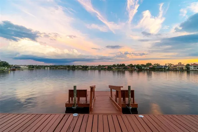 a view of a kitchen with a sink and a chandelier fan