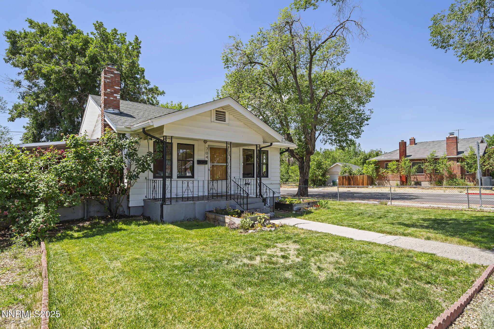 704 Roberts Street Reno, NV 89502 - Photo 3 of 52 a view of a house with a yard and sitting area