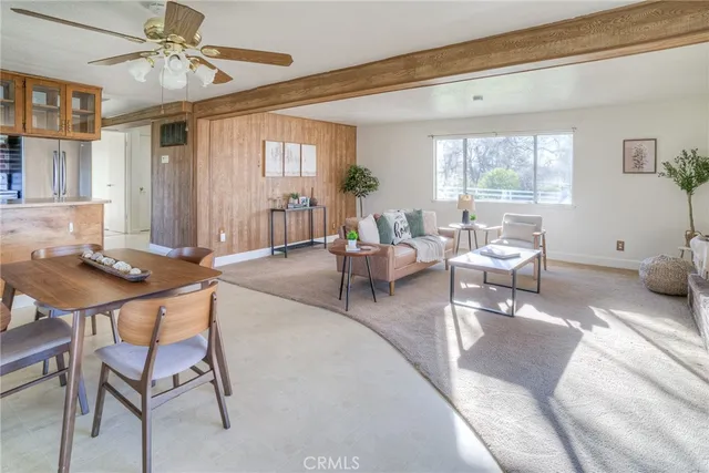 a kitchen with stainless steel appliances granite countertop a refrigerator a sink a stove and a refrigerator