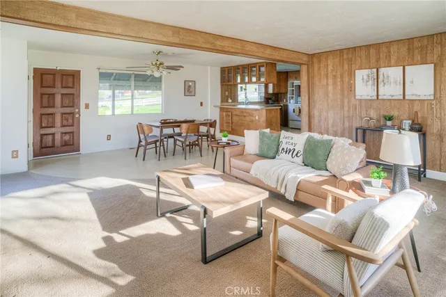a living room with furniture and a window