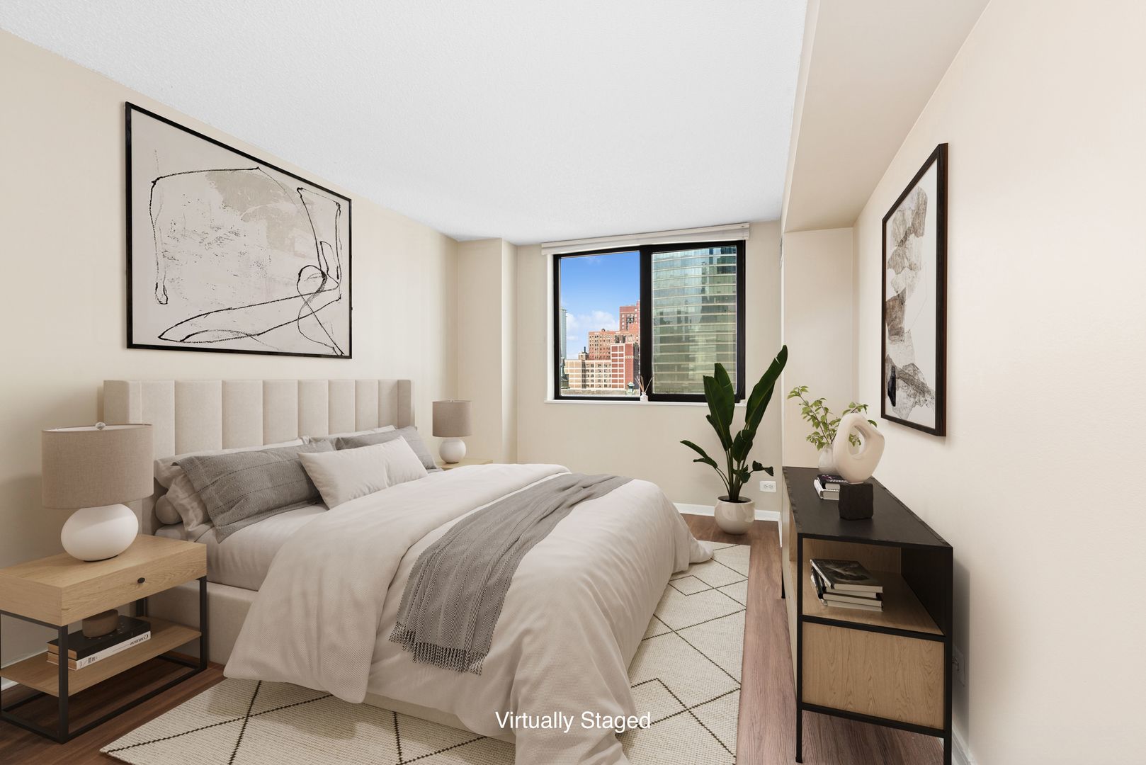 33 West Delaware Place, Unit 10B Chicago, IL 60610 - Photo 6 of 19 a bedroom with a bed and wooden floor