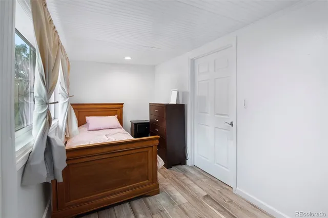 a room with a closet and wooden floor