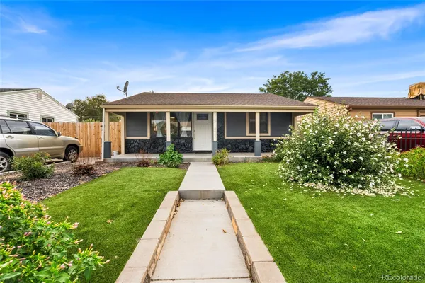 front view of a house with a yard