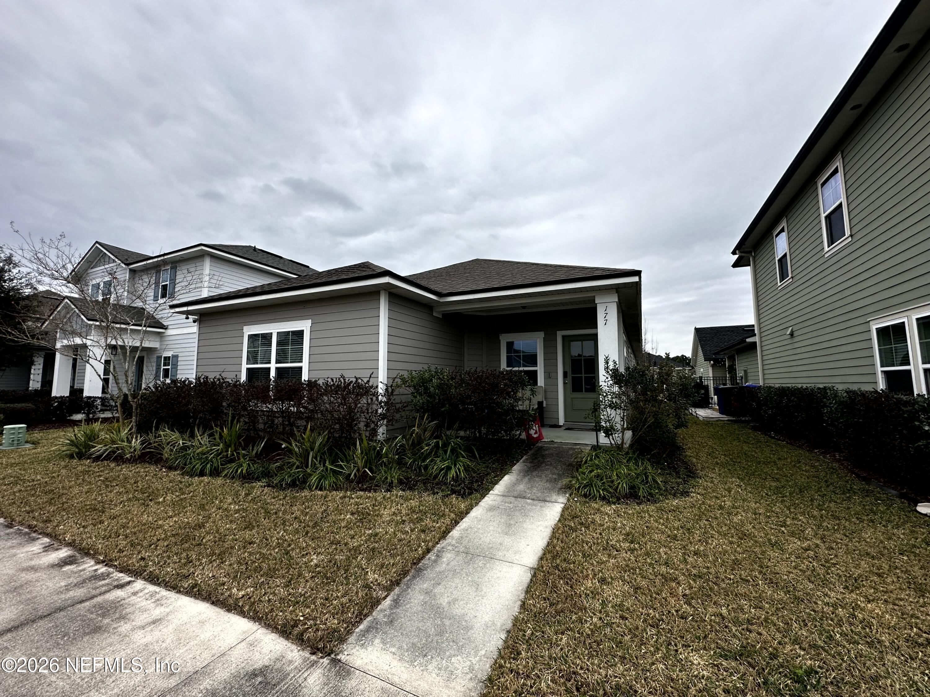 177 Clarys Run St. Augustine, FL 32092 - Photo 16 of 16 a front view of house with yard and green space