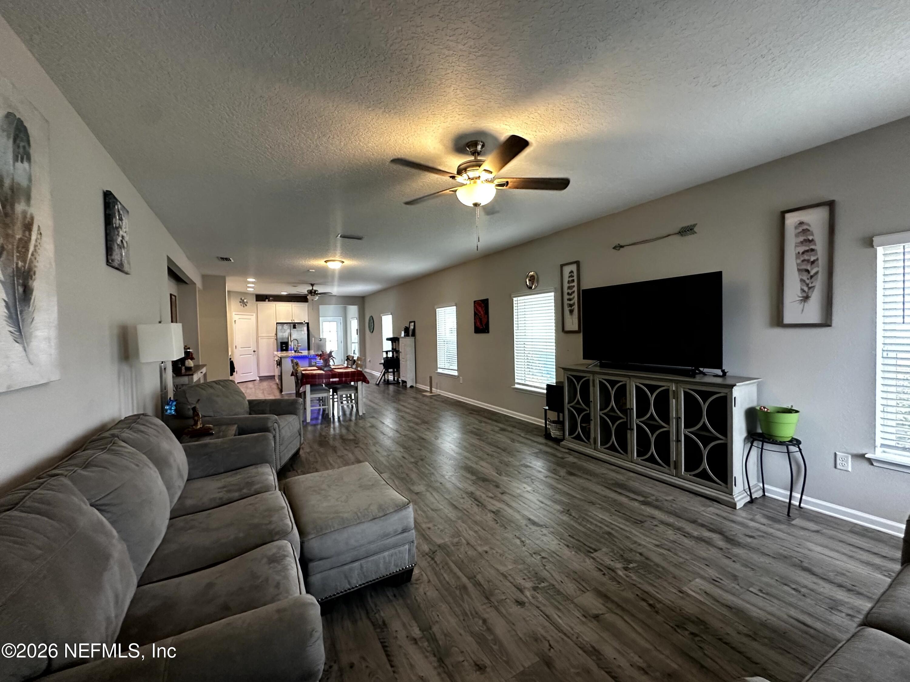 177 Clarys Run St. Augustine, FL 32092 - Photo 3 of 16 a living room with furniture and a flat screen tv