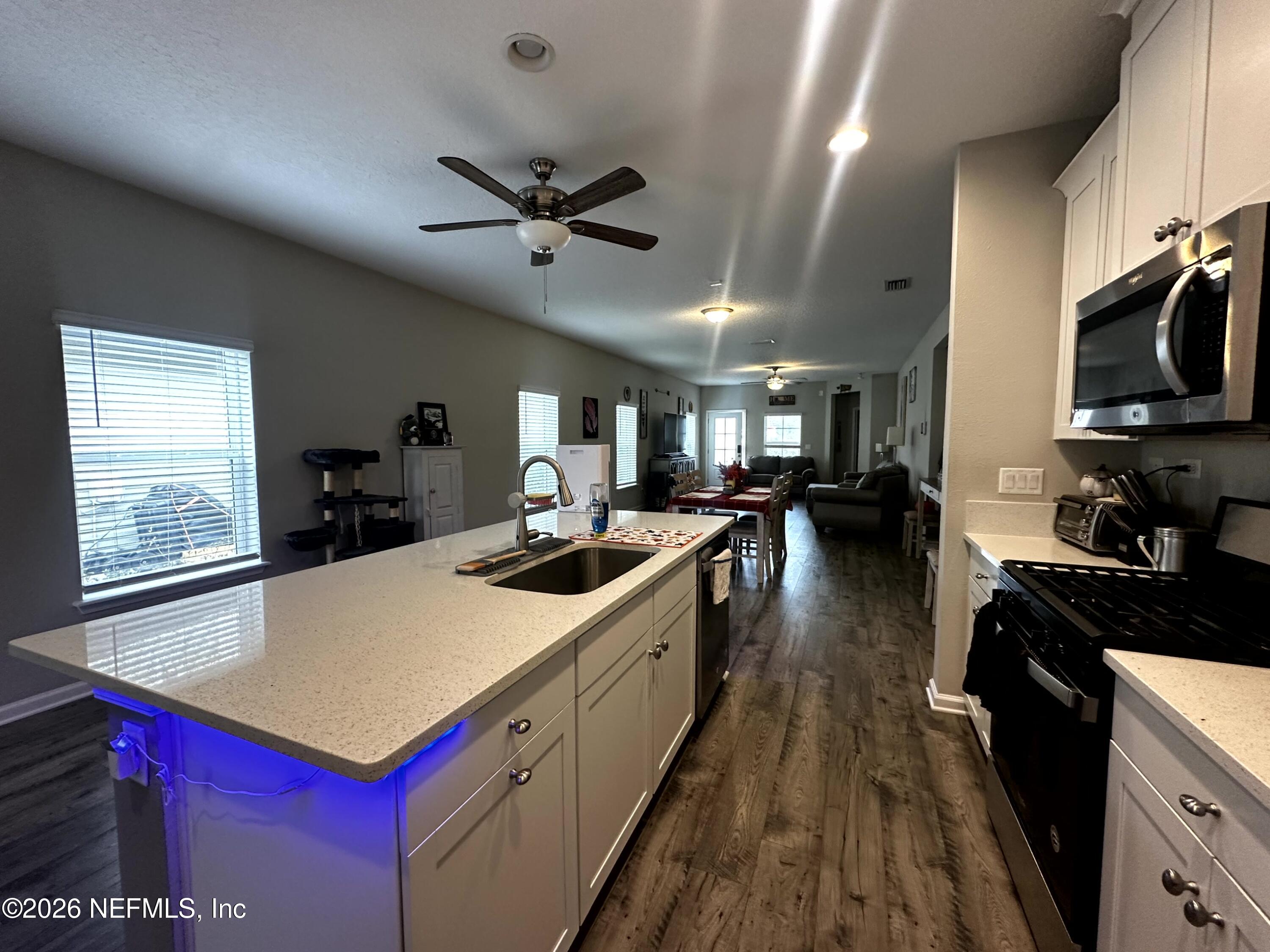 177 Clarys Run St. Augustine, FL 32092 - Photo 6 of 16 a kitchen with kitchen island a sink stove and refrigerator