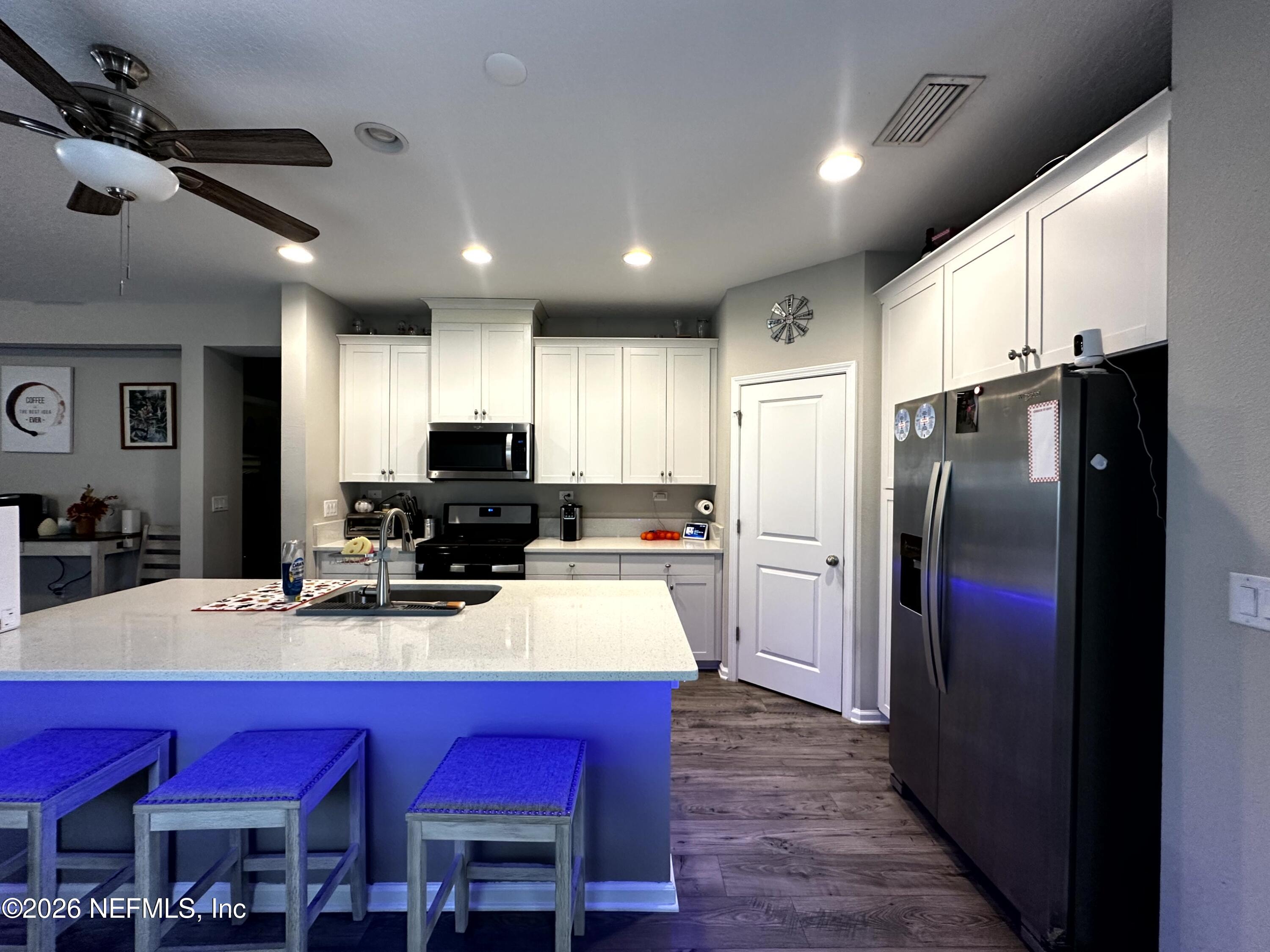 177 Clarys Run St. Augustine, FL 32092 - Photo 9 of 16 a kitchen with a refrigerator a stove and a sink