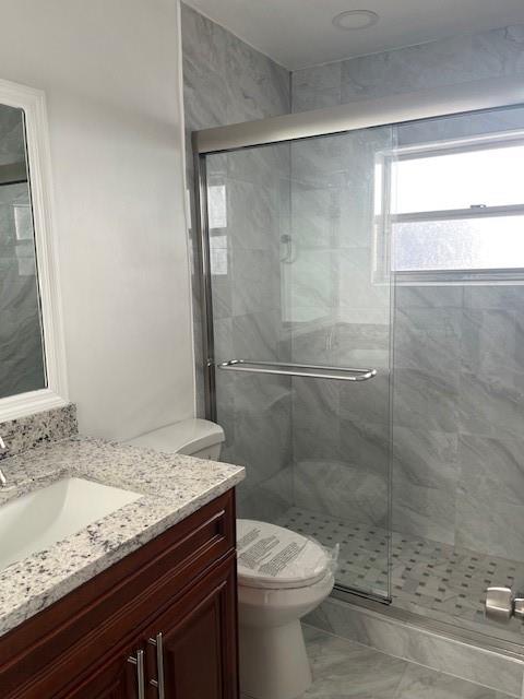 5100 Southwest 90th Avenue, Unit 410 Cooper City, FL 33328 - Photo 11 of 15 a bathroom with a granite countertop sink toilet and shower