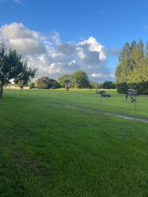 5100 Southwest 90th Avenue, Unit 410 Cooper City, FL 33328 - Photo 2 of 15 a view of a green field with trees in the background