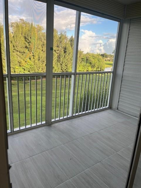 5100 Southwest 90th Avenue, Unit 410 Cooper City, FL 33328 - Photo 4 of 15 a view of a room with wooden floor and windows
