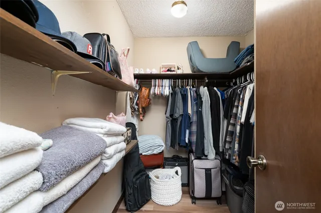 a bedroom with a bed and a mirror