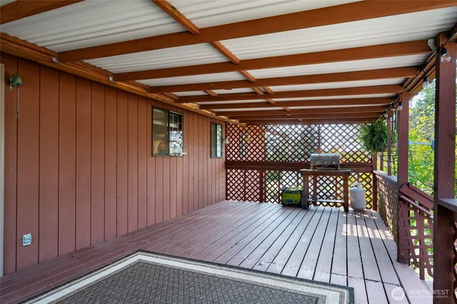 a view of balcony with wooden floor