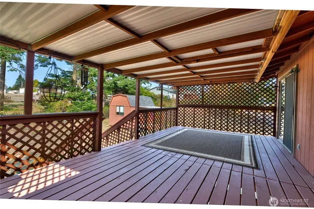 a balcony view with wooden floor