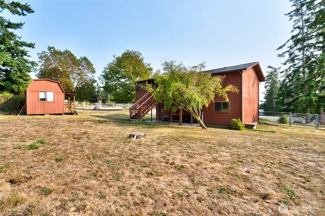 a view of outdoor space with playground and green space