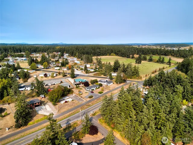 an aerial view of residential building and lake