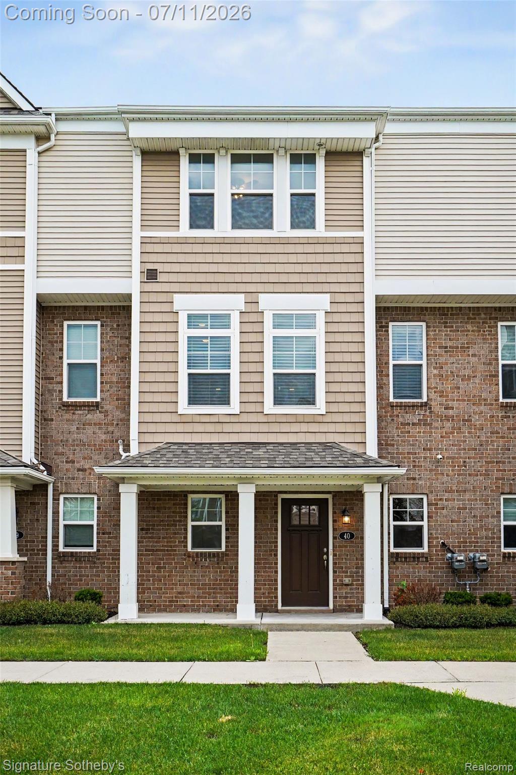 2500 Normandy Road, Unit 40 Royal Oak, MI 48073 - Photo 4 of 26 Three-story townhome with brick and shake siding accents