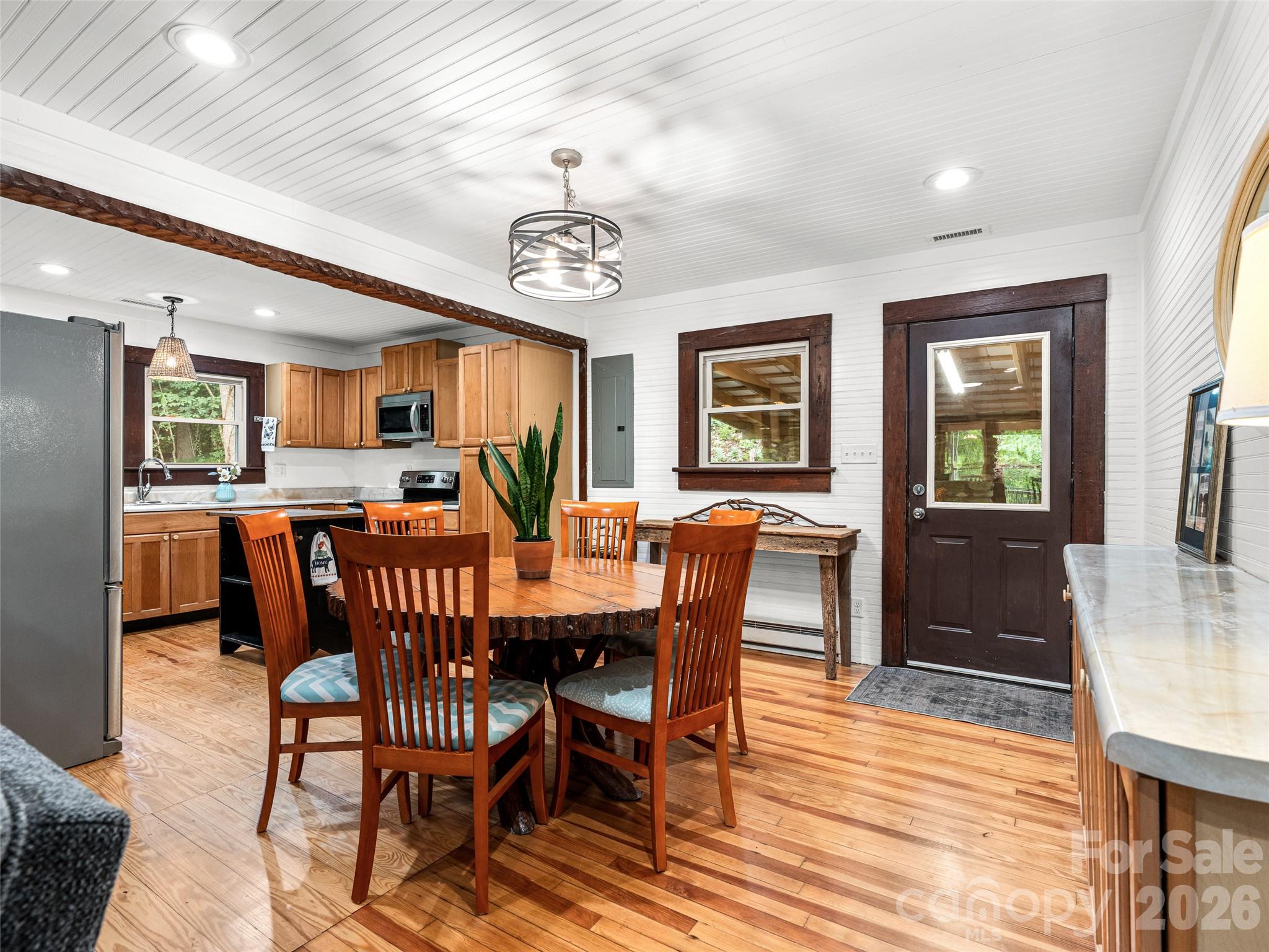 206 Chestnut Hill Road Gerton, NC 28735 - Photo 13 of 48 a view of a dining room with furniture window and wooden floor