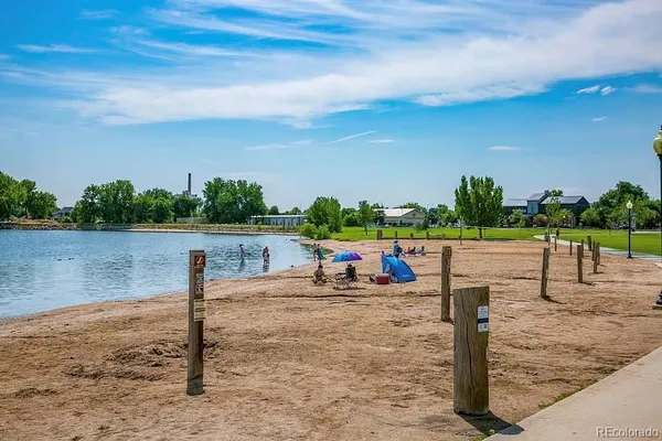 a view of a lake with a table and chairs
