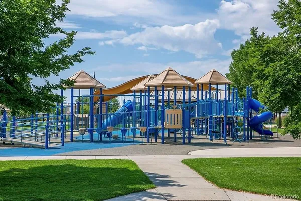 a view of a big yard with table and chairs a fire pit and a yard