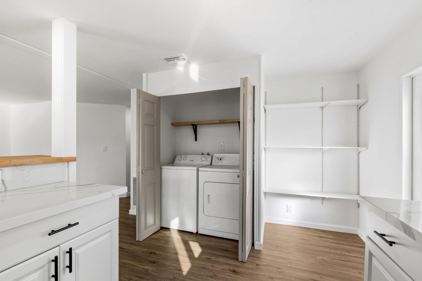 20 Russell Road, Unit 86 Salinas, CA 93906 - Photo 16 of 43 a kitchen with a refrigerator and a stove top oven