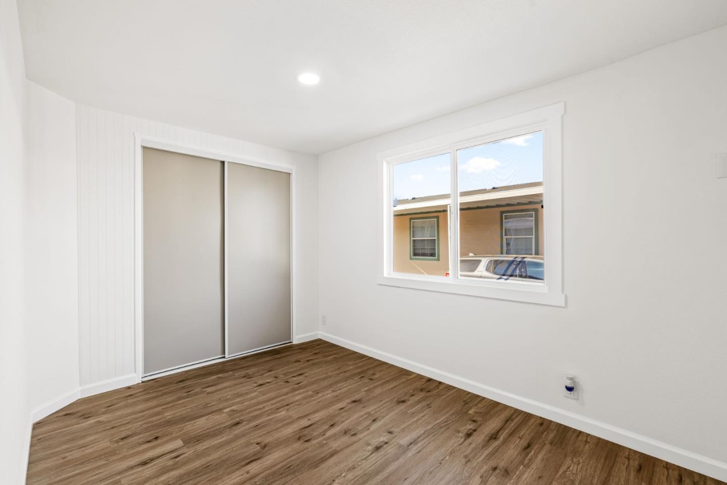 20 Russell Road, Unit 86 Salinas, CA 93906 - Photo 20 of 43 a view of empty room with wooden floor and fan