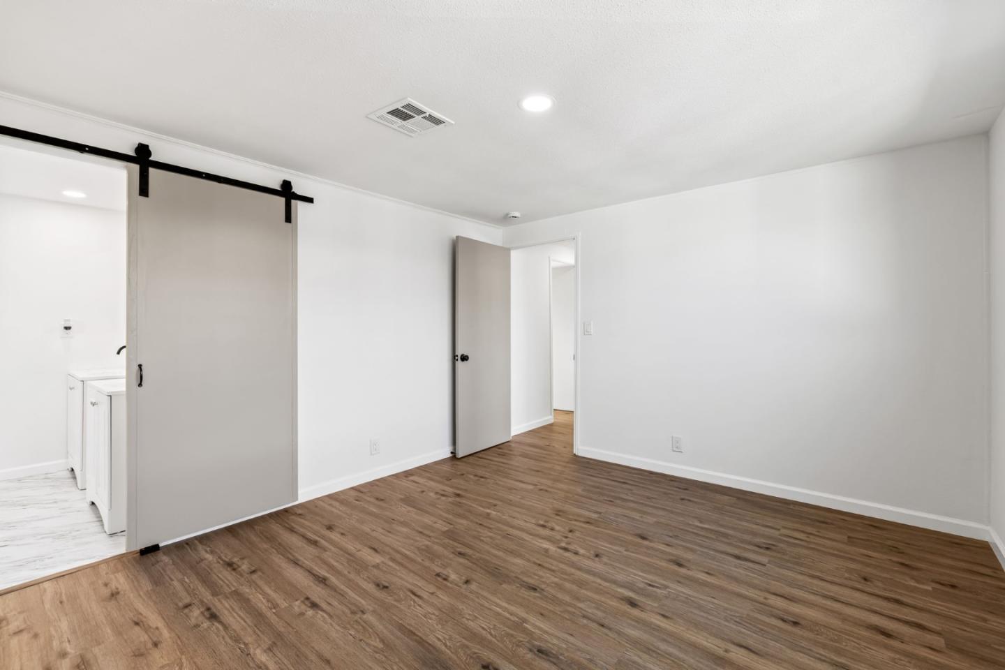 20 Russell Road, Unit 86 Salinas, CA 93906 - Photo 22 of 43 a view of an empty room with wooden floor