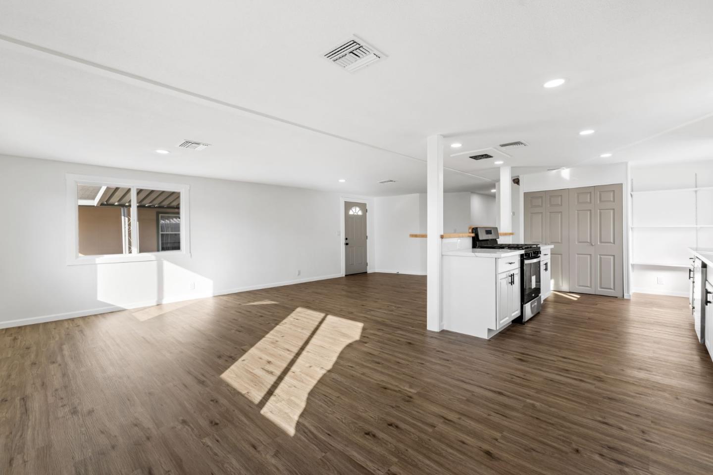 20 Russell Road, Unit 86 Salinas, CA 93906 - Photo 29 of 43 a view of kitchen living room with wooden floor and cabinets