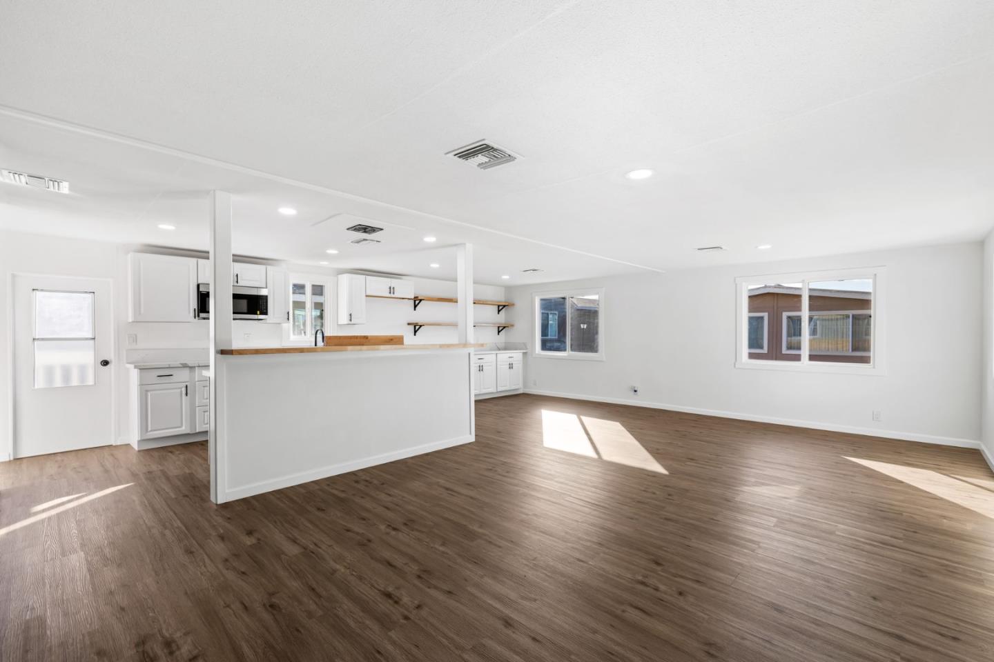 20 Russell Road, Unit 86 Salinas, CA 93906 - Photo 3 of 43 a view of a kitchen with wooden floor and windows