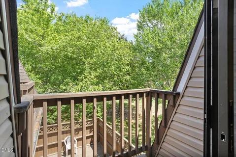 a view of balcony with wooden floor