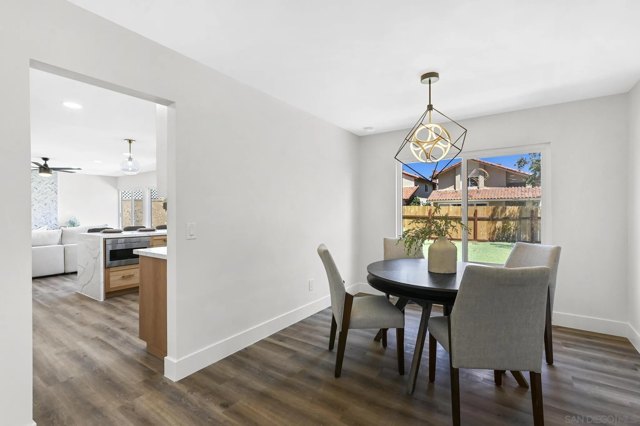 14463 Janal Way San Diego, CA 92129 - Photo 11 of 44 a view of a dining room with furniture and wooden floor