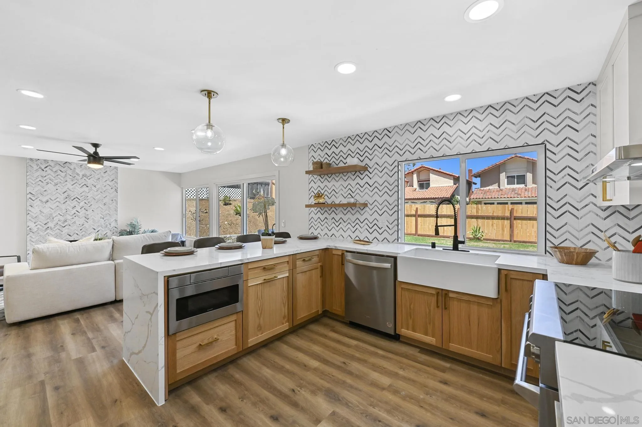 14463 Janal Way San Diego, CA 92129 - Photo 13 of 44 a kitchen with a stove and a sink