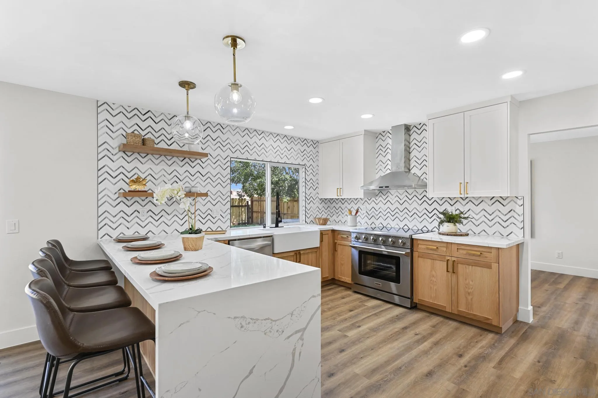 14463 Janal Way San Diego, CA 92129 - Photo 14 of 44 a kitchen with a stove a sink and a refrigerator