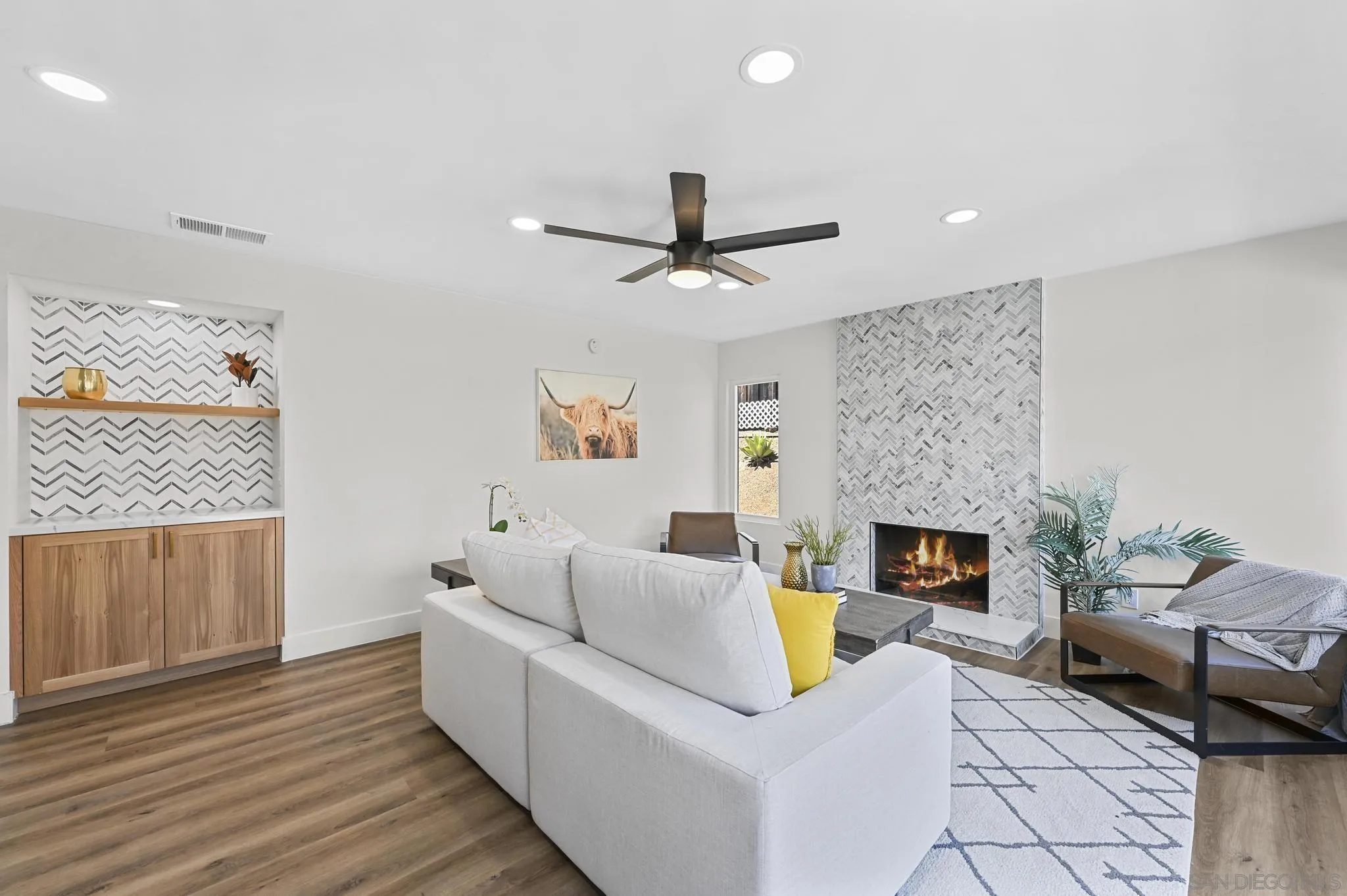 14463 Janal Way San Diego, CA 92129 - Photo 19 of 44 a living room with furniture and a fireplace