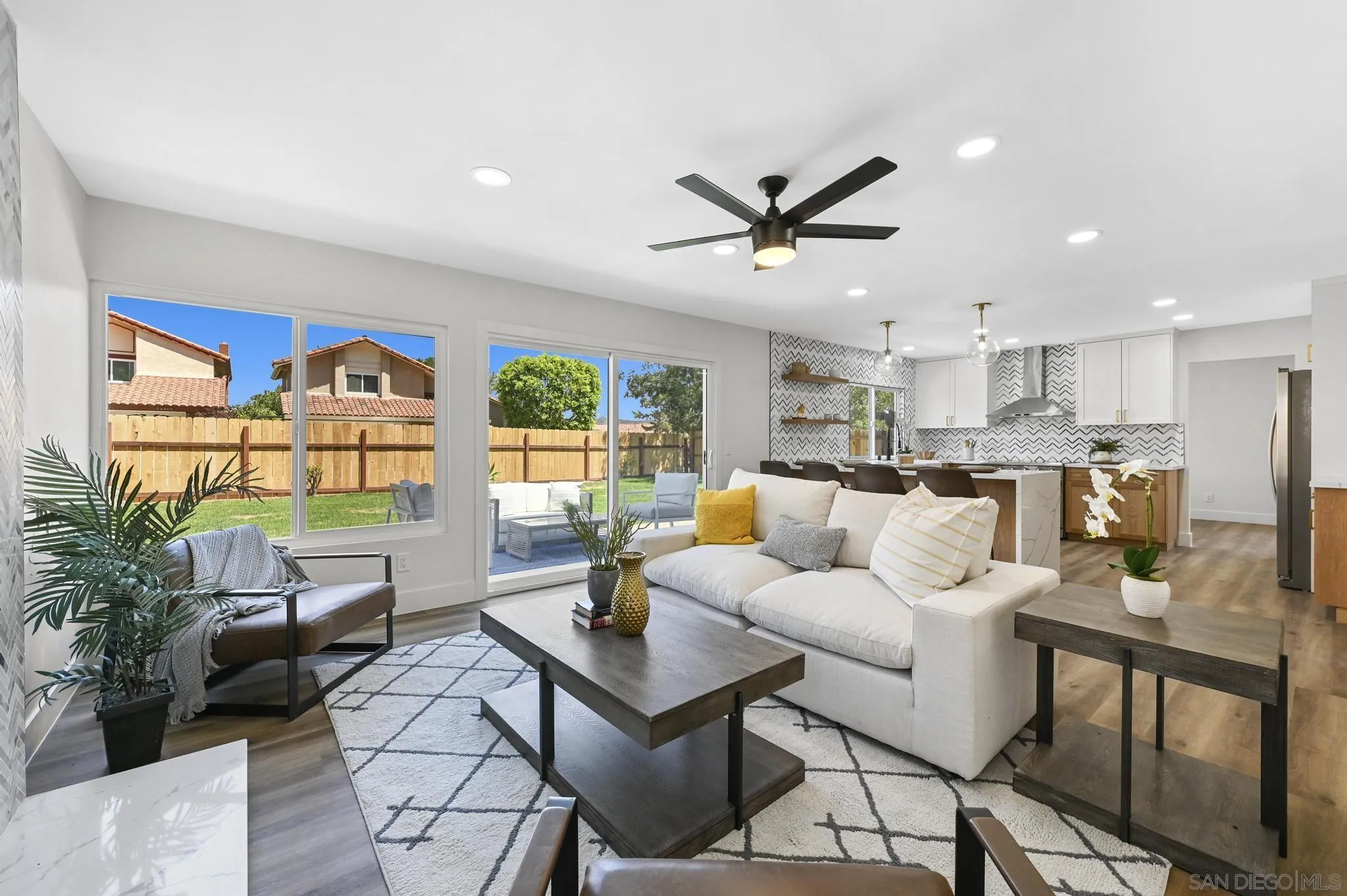 14463 Janal Way San Diego, CA 92129 - Photo 21 of 44 a living room with furniture kitchen view and a large window