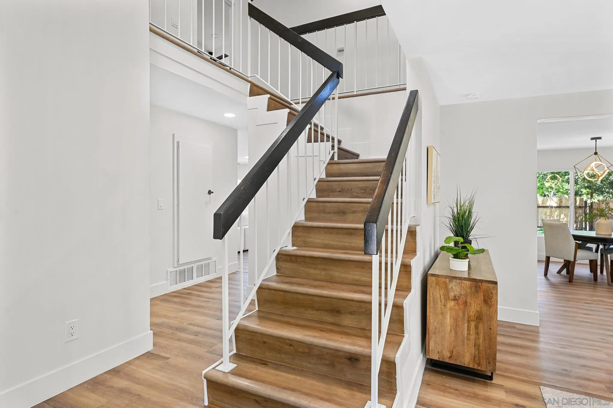 14463 Janal Way San Diego, CA 92129 - Photo 22 of 44 a view of entryway and hall with wooden floor