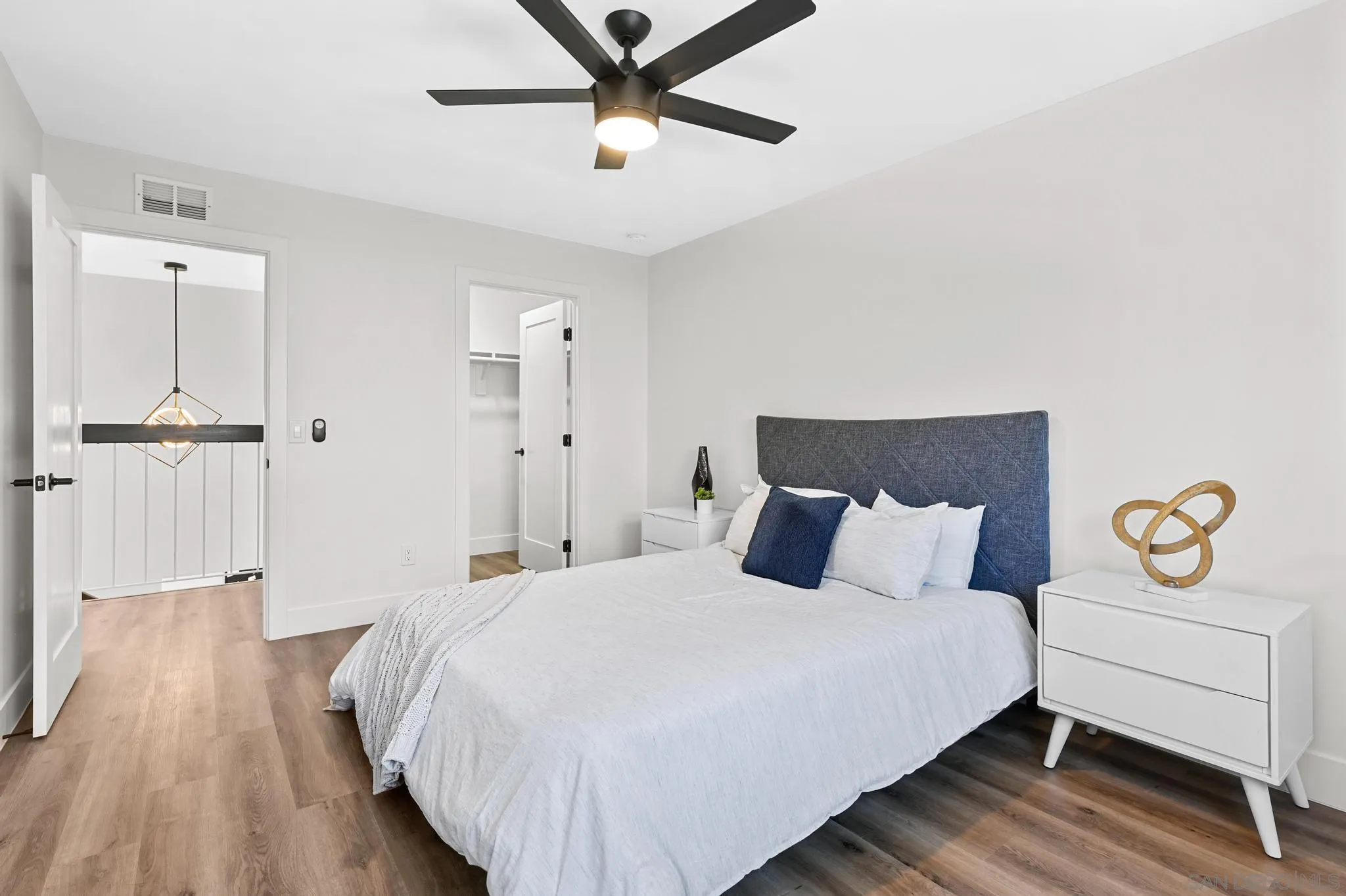 14463 Janal Way San Diego, CA 92129 - Photo 25 of 44 a bedroom with a bed and painting on the wall