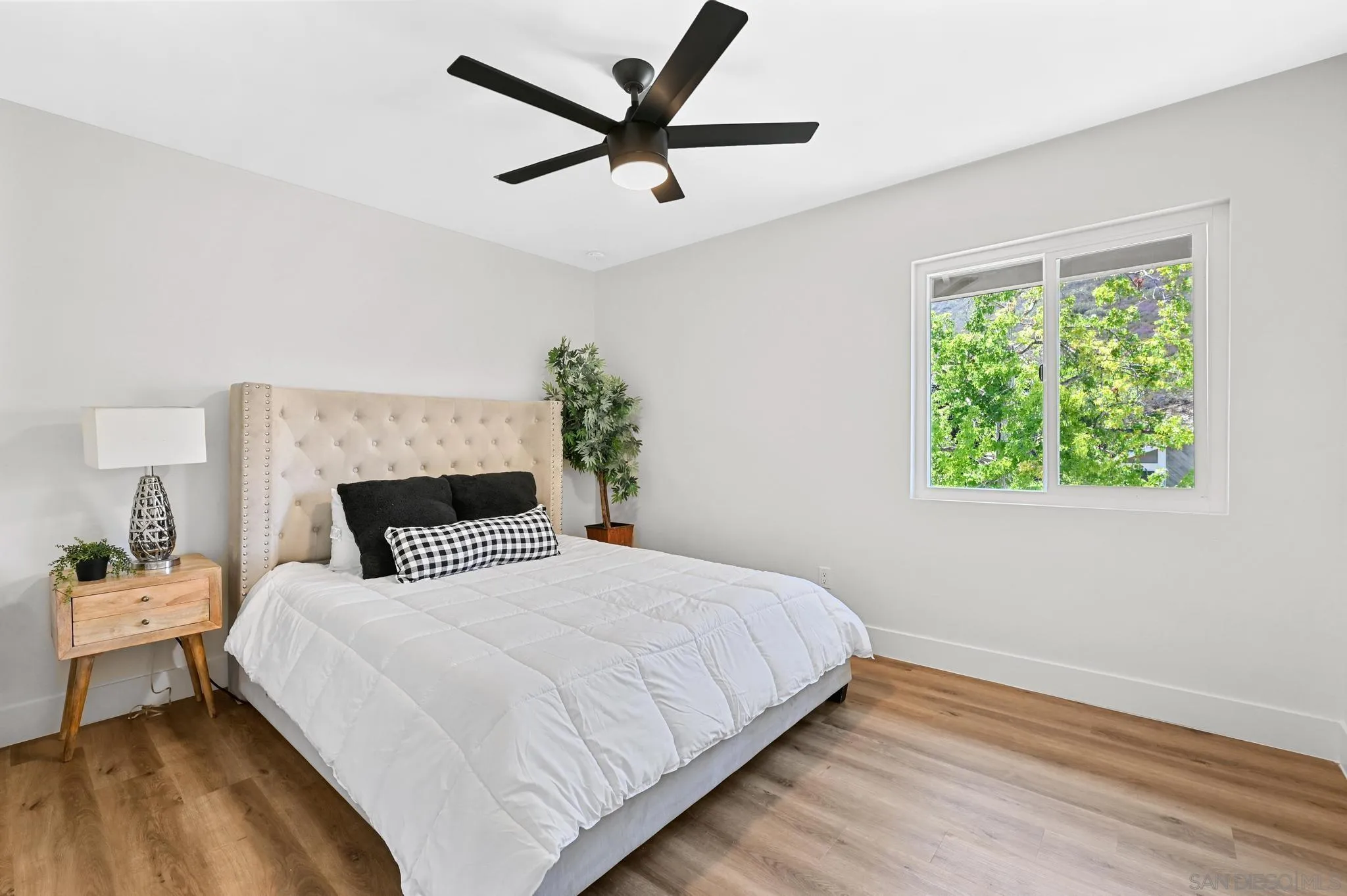 14463 Janal Way San Diego, CA 92129 - Photo 27 of 44 a bedroom with a bed and a window