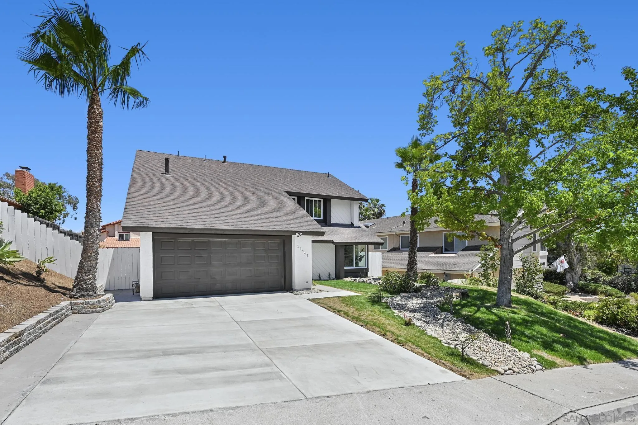14463 Janal Way San Diego, CA 92129 - Photo 3 of 44 a view of a house with a yard and potted plants