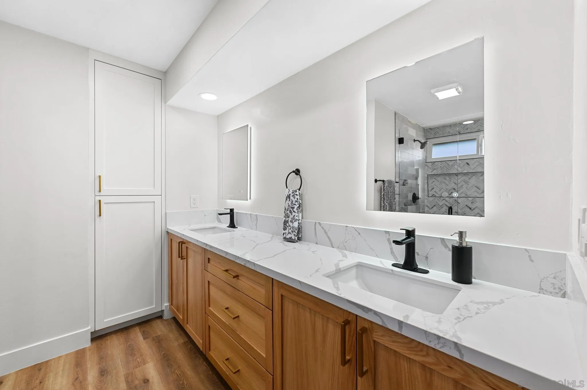 14463 Janal Way San Diego, CA 92129 - Photo 33 of 44 a bathroom with a double vanity sink and a window
