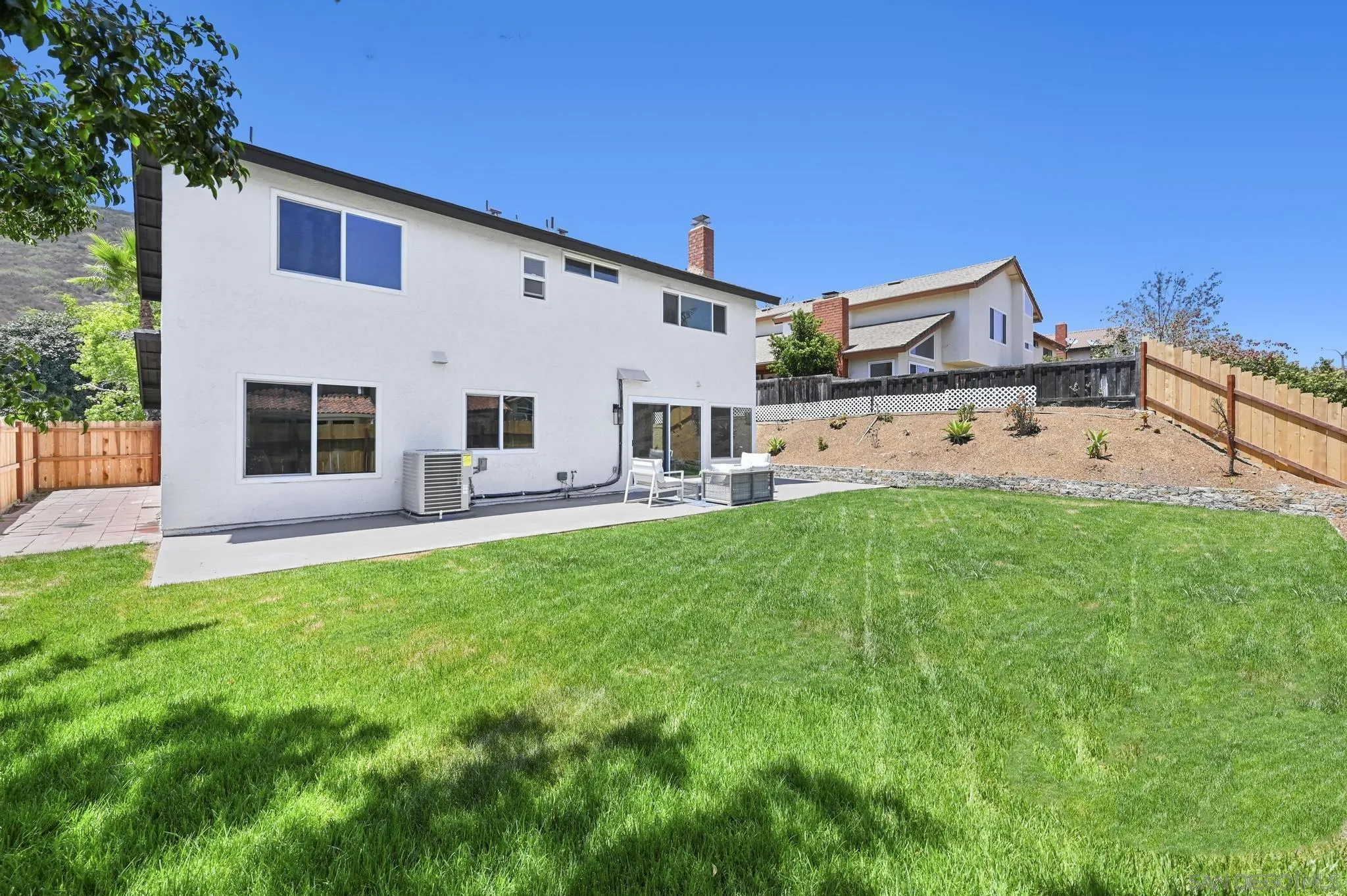 14463 Janal Way San Diego, CA 92129 - Photo 36 of 44 a view of a house with backyard and a garden
