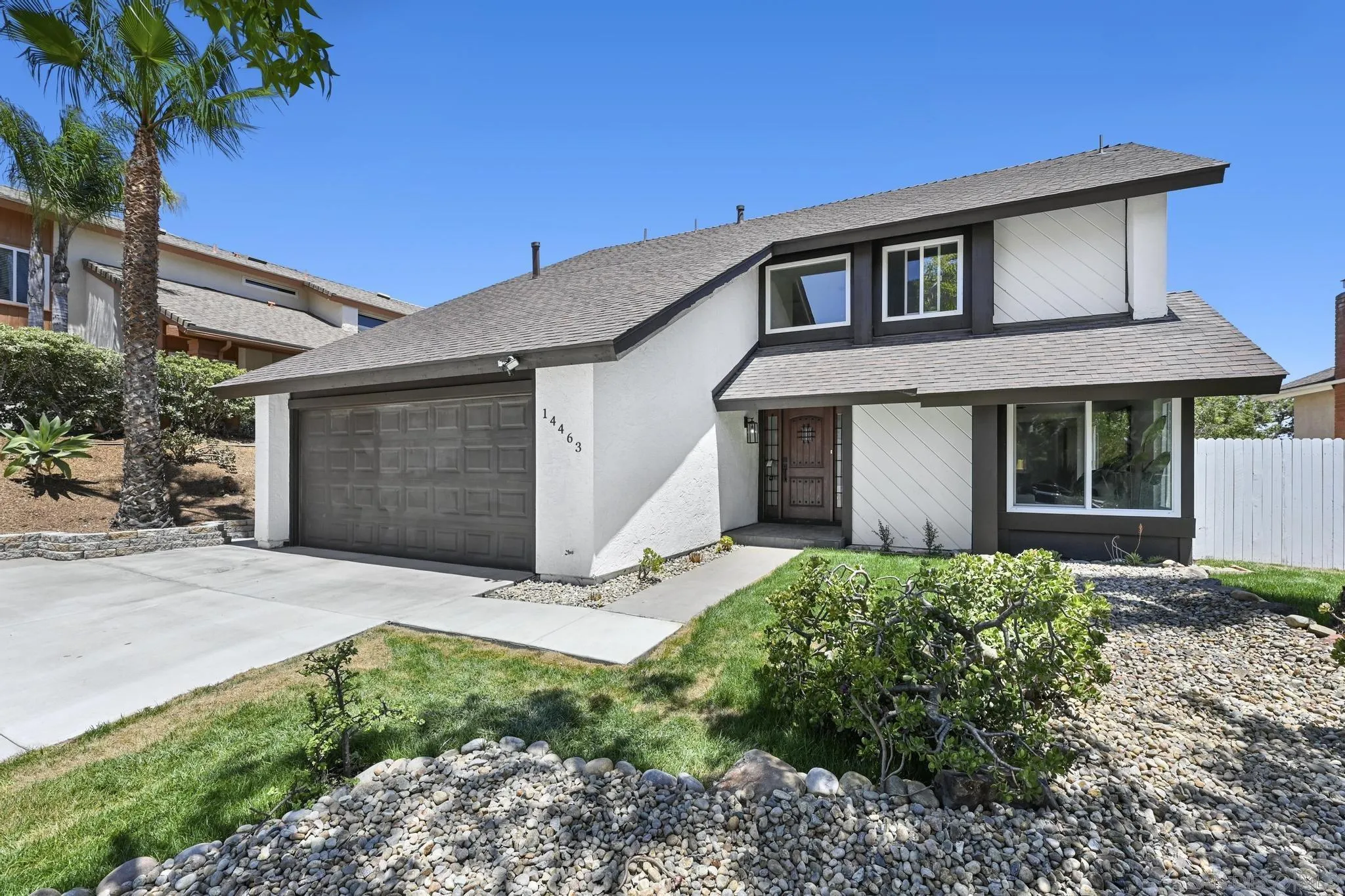 14463 Janal Way San Diego, CA 92129 - Photo 4 of 44 a front view of a house with garden