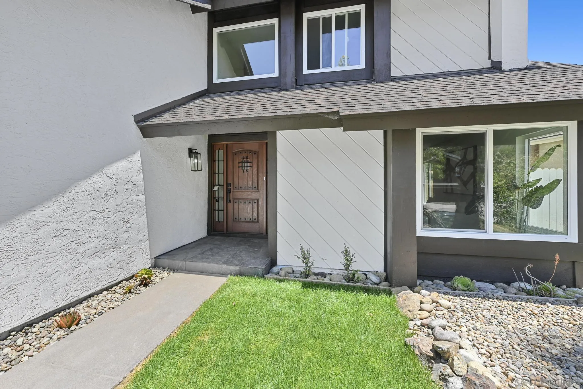 14463 Janal Way San Diego, CA 92129 - Photo 5 of 44 a house view with a outdoor space