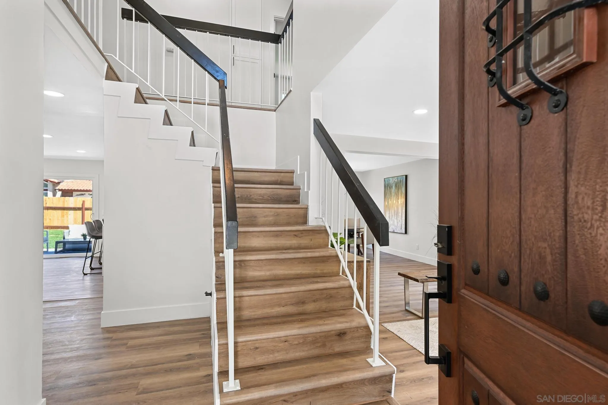 14463 Janal Way San Diego, CA 92129 - Photo 6 of 44 a view of entryway and hall with wooden floor